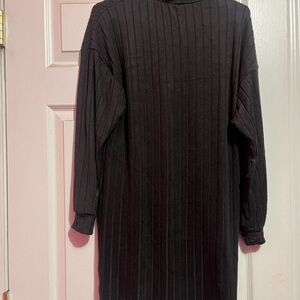 New black turtle neck dress. Party ready, work ready .casual or dress it up